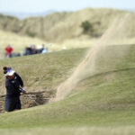 
              Megan Khang of United States' plays her shot from the bunker at the 17th during the second round of the Women's British Open golf championship, in Muirfield, Scotland Friday, Aug. 5, 2022. (AP Photo/Scott Heppell)
            