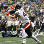 
              Chicago Bears tight end Jake Tonges catches a pass for a touchdown during the first half of a preseason NFL football game against the Seattle Seahawks, Thursday, Aug. 18, 2022, in Seattle. (AP Photo/Caean Couto)
            