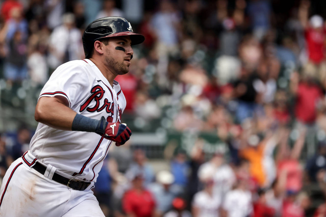 Atlanta Braves' Austin Riley runs to first on a game winning RBI during the ninth inning of a baseb...