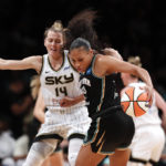 
              New York Liberty forward Betnijah Laney (44) drives to the basket against Chicago Sky guard Allie Quigley (14) during the first half of a WNBA basketball playoff game Tuesday, Aug. 23, 2022, in New York. (AP Photo/Noah K. Murray)
            