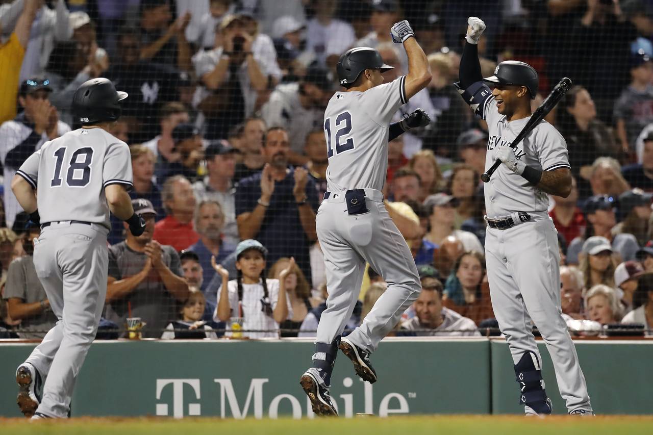 New York Yankees' Isiah Kiner-Falefa (12) celebrates with Aaron Hicks after hitting a two-run home ...