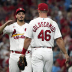 
              St. Louis Cardinals' Nolan Arenado and Paul Goldschmidt (46) celebrate a 3-1 victory over the Milwaukee Brewers following a baseball game Friday, Aug. 12, 2022, in St. Louis. (AP Photo/Jeff Roberson)
            