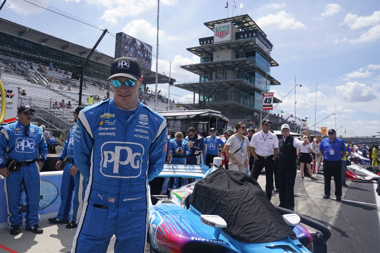 Josef Newgarden waits in the pits before a IndyCar auto race at Indianapolis Motor Speedway, Saturd...