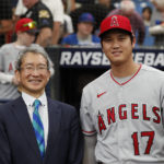 
              Los Angeles Angels' Shohei Ohtani stands next Consul-General of Japan in Miami Kazuhiro Sakai for photos before the Angels played Tampa Bay Rays during a baseball game Thursday, Aug. 25, 2022, in St. Petersburg, Fla. (AP Photo/Scott Audette)
            