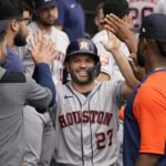 
              Houston Astros' Jose Altuve celebrates in the dugout after scoring on a double by Yordan Alvarez during the fourth inning of a baseball game against the Chicago White Sox Thursday, Aug. 18, 2022, in Chicago. (AP Photo/Charles Rex Arbogast)
            