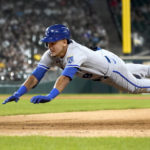 
              Kansas City Royals' Nicky Lopez dives back to first after his single off Chicago White Sox starting pitcher Lucas Giolito in the fourth inning of a baseball game Tuesday, Aug. 2, 2022, in Chicago. (AP Photo/Charles Rex Arbogast)
            