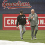 
              Chicago White Sox manager Tony LaRussa, left, and Ed Cassin, director of team travel walk in the outfield at Progressive Field while inspecting the field after a heavy rain before a baseball game against the Cleveland Guardians in Cleveland, Sunday, Aug. 21, 2022. (AP Photo/Phil Long)
            