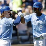 
              Kansas City Royals' Bobby Witt Jr. (7) congratulates Michael A. Taylor (2) at home plate after Taylor hit a solo home run during the first inning of a baseball game against the San Diego Padres in Kansas City, Mo., Sunday, Aug. 28, 2022. (AP Photo/Colin E. Braley)
            
