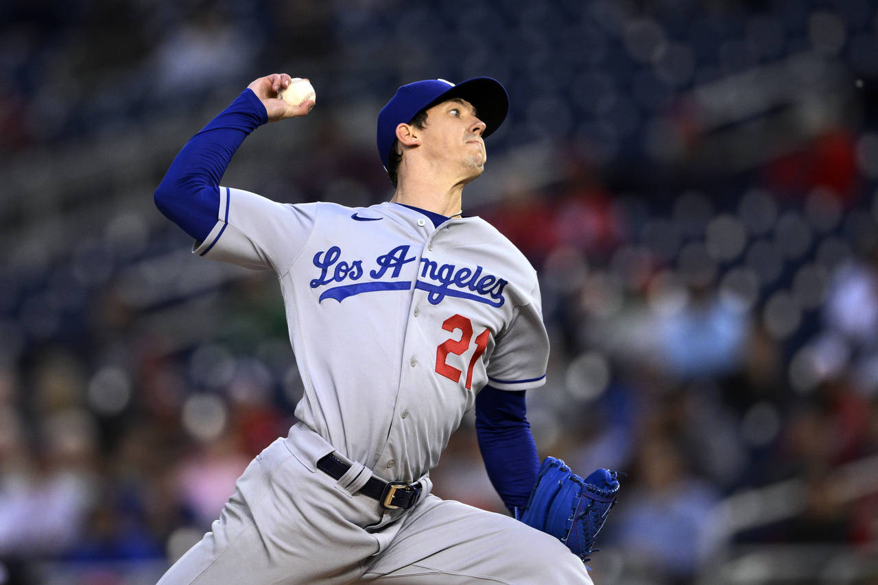 FILE - Los Angeles Dodgers starting pitcher Walker Buehler throws during the team's baseball game a...