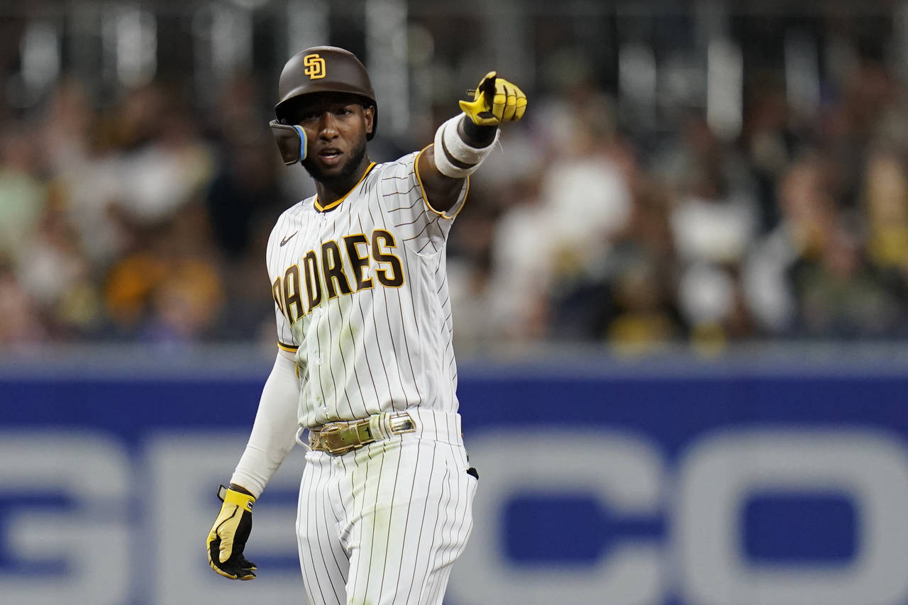 San Diego Padres' Jurickson Profar reacts after hitting a double during the fifth inning of a baseb...