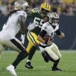 
              New Orleans Saints quarterback Ian Book (16) carries during the first half of a preseason NFL football game against the Green Bay Packers Friday, Aug. 19, 2022, in Green Bay, Wis. (AP Photo/Matt Ludtke)
            