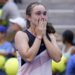 
              Daria Snigur, of Ukraine, reacts after upsetting Simona Halep, of Romania, during the first round of the US Open tennis championships, Monday, Aug. 29, 2022, in New York. (AP Photo/Seth Wenig)
            