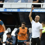 
              Manchester City's head coach Pep Guardiola gestures during the English Premier League soccer match between Newcastle United and Manchester City at St James Park in Newcastle, England, Sunday, Aug.21, 2022. (AP Photo/Rui Vieira)
            