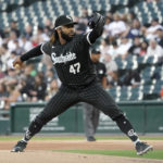 
              Chicago White Sox starting pitcher Johnny Cueto winds up during the first inning of the team's baseball game against the Houston Astros on Monday, Aug. 15, 2022, in Chicago. (AP Photo/Charles Rex Arbogast)
            