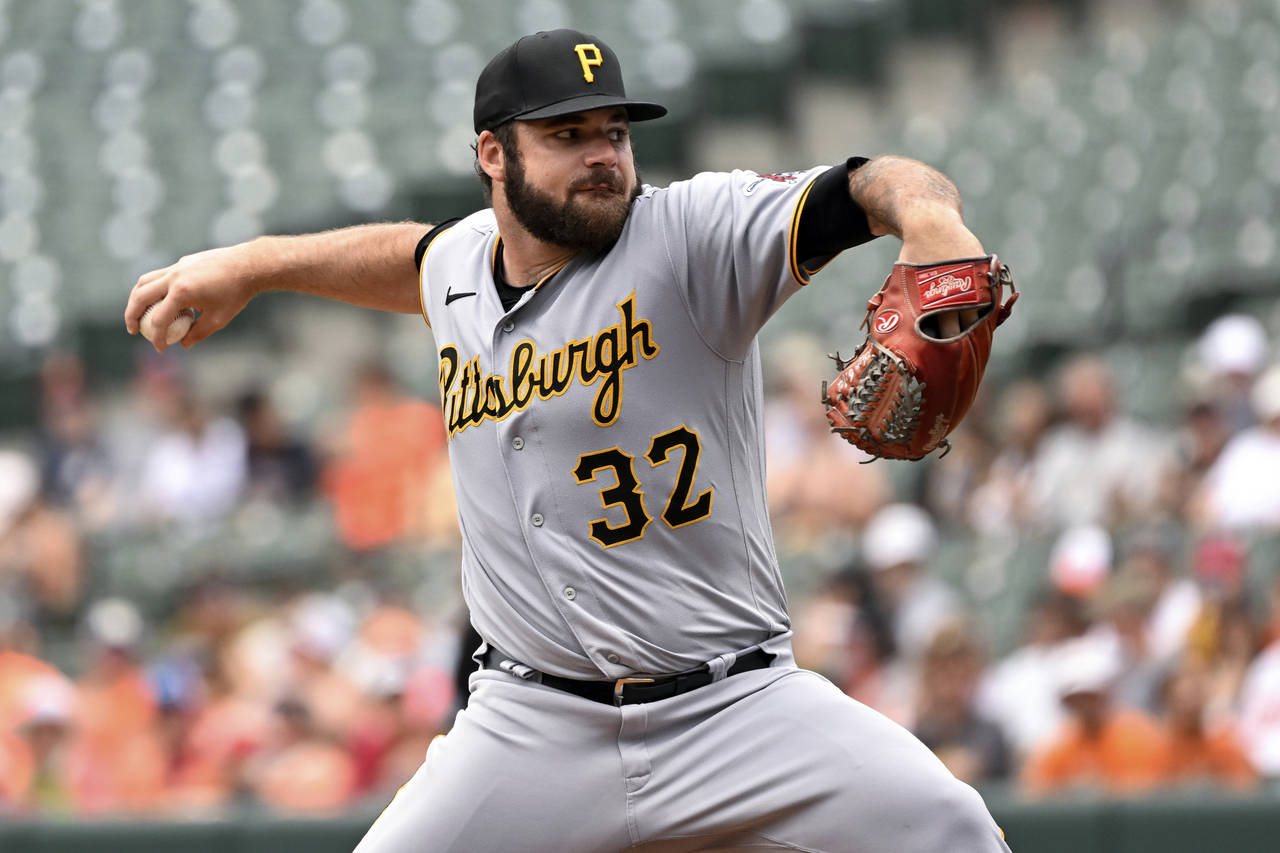 Pittsburgh Pirates starting pitcher Bryse Wilson (32) throws during the first inning of a baseball ...