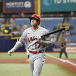 
              Los Angeles Angels' Shohei Ohtani reacts after striking out looking against the Tampa Bay Rays during the first inning Thursday, Aug. 25, 2022, in St. Petersburg, Fla. (AP Photo/Scott Audette)
            