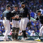 
              Miami Marlins manager Don Mattingly (8) pulls starting pitcher Pablo Lopez, center, after Lopez gave up a home run to Chicago Cubs' P.J. Higgins during the sixth inning of a baseball game Saturday, Aug. 6, 2022, in Chicago. (AP Photo/Charles Rex Arbogast)
            