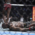 
              Nigerian UFC fighter Kamaru Usman is knocked out by UFC fighter Leon Edwards, of Jamaica, during their welterweight championship bout at UFC 278 in Salt Lake City on Saturday, Aug. 20, 2022.  (Francisco Kjolseth/The Salt Lake Tribune via AP)
            