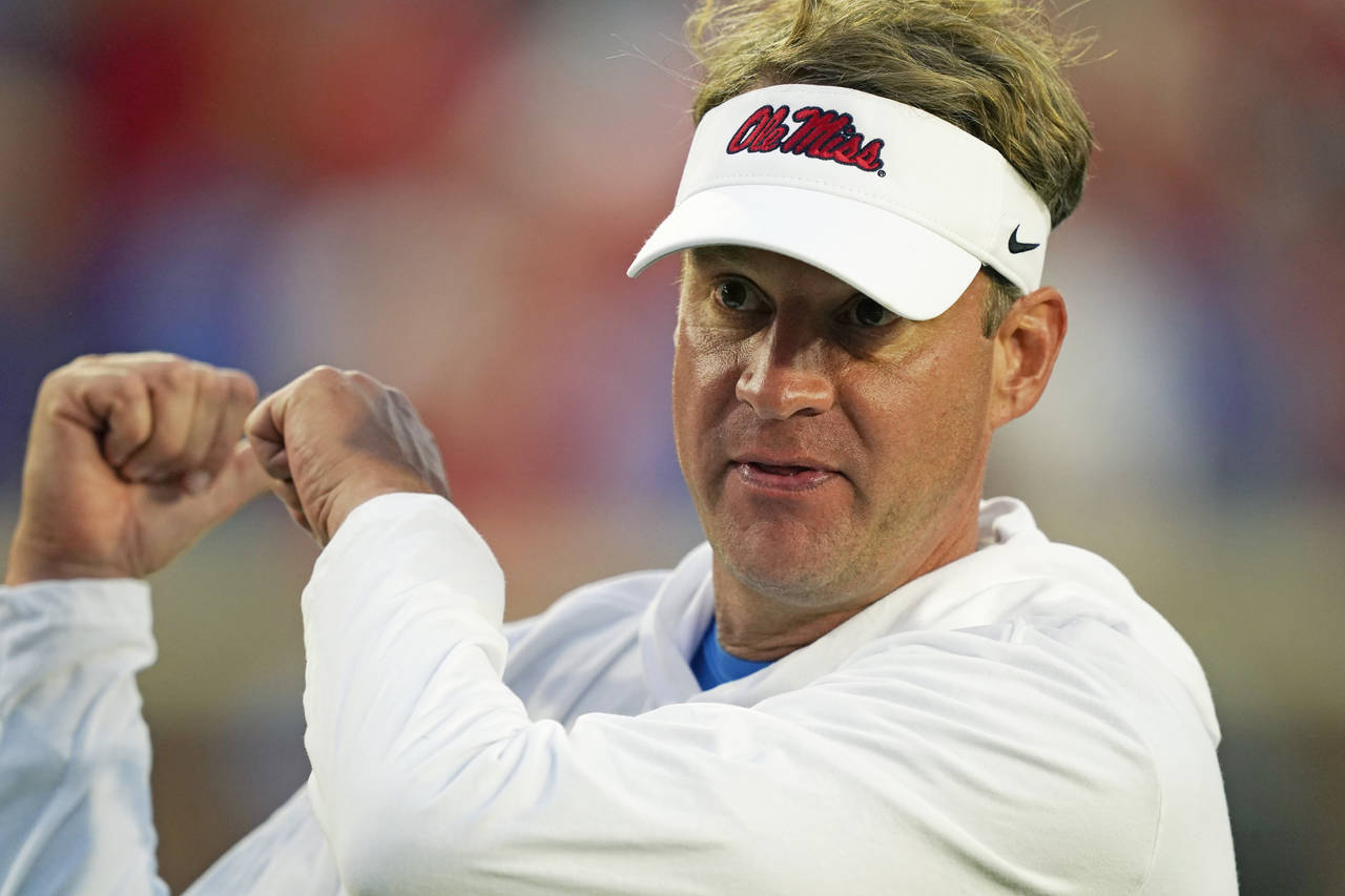 FILE - Mississippi head coach Lane Kiffin gestures following his team's 31-17 win over LSU during a...