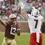 
              Florida State quarterback Jordan Travis (13) is pressured by Duquesne linebacker Lucas D'Orazio (7) in the second quarter of an NCAA college football game Saturday, Aug. 27, 2022, in Tallahassee, Fla. (AP Photo/Phil Sears)
            
