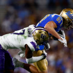 PASADENA, CALIFORNIA - SEPTEMBER 30:  Hudson Habermehl #81 of the UCLA Bruins runs against Dominique Hampton #7 of the Washington Huskies in the second quarter at Rose Bowl Stadium on September 30, 2022 in Pasadena, California. (Photo by Ronald Martinez/Getty Images)