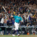 SEATTLE, WASHINGTON - SEPTEMBER 30: Cal Raleigh #29 of the Seattle Mariners celebrates his walk-off home run during the ninth inning against the Oakland Athletics at T-Mobile Park on September 30, 2022 in Seattle, Washington. With the win, the Seattle Mariners have clinched a postseason appearance for the first time  in 21 years, the longest playoff drought in North American professional sports. (Photo by Steph Chambers/Getty Images)