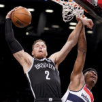 
              FILE - Brooklyn Nets forward Blake Griffin (2) rebounds against Washington Wizards forward Rui Hachimura (8) in the first half of an NBA basketball game, Thursday, Feb. 17, 2022, in New York. Veteran big man Blake Griffin has agreed to a contract with the Boston Celtics, a person familiar with the deal told The Associated Press on Friday, Sept. 30, 2022. (AP Photo/John Minchillo, File)
            