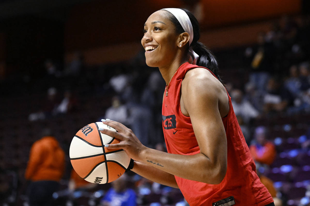 Las Vegas Aces' A'ja Wilson warms up for Game 3 of the basketball team's WNBA Finals against the Co...