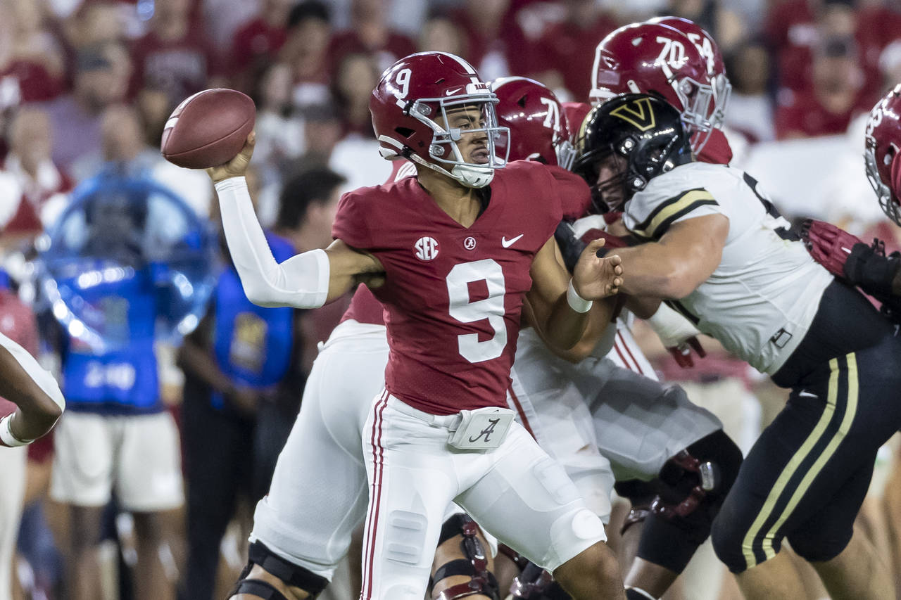 Alabama quarterback Bryce Young (9) throws a pass during the first half of the team's NCAA college ...