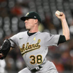 
              Oakland Athletics starting pitcher JP Sears throws during the third inning of the team's baseball game against the Baltimore Orioles, Friday, Sept. 2, 2022, in Baltimore. (AP Photo/Nick Wass)
            