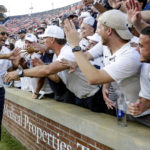 
              Penn State head coach James Franklin celebrates with fans after their victory over Auburn in an NCAA college football game, Saturday, Sept. 17, 2022, in Auburn, Ala. (AP Photo/Butch Dill)
            
