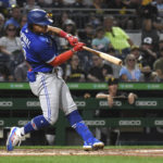 
              Toronto Blue Jays' Santiago Espinal hits a two-run double off Pittsburgh Pirates pitcher Tyler Beede during the fourth inning of a baseball game, Friday, Sept. 2, 2022, in Pittsburgh. (AP Photo/Philip G. Pavely)
            