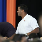
              Denver Broncos quarterback Russell Wilson, right, greets a well-wisher at the NFL football team's kickoff luncheon Friday, Aug. 26, 2022, at the Broncos' headquarters in Centennial, Colo. (AP Photo/David Zalubowski)
            