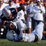 
              Auburn quarterback Robby Ashford (9) is sacked by Penn State linebacker Abdul Carter (11) during the second half of an NCAA college football game, Saturday, Sept. 17, 2022, in Auburn, Ala. (AP Photo/Butch Dill)
            