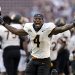 
              Appalachian State running back Daetrich Harrington (4) reacts as time expires after upsetting No. 6 Texas A&M in an NCAA college football game Saturday, Sept. 10, 2022, in College Station, Texas. (AP Photo/Sam Craft)
            