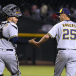 
              Milwaukee Brewers catcher Victor Caratini and pitcher Taylor Rogers (25) celebrate after the Brewers defeated the Arizona Diamondbacks 8-6 in a baseball game Saturday, Sept. 3, 2022, in Phoenix. (AP Photo/Rick Scuteri)
            