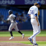 
              Toronto Blue Jays starting pitcher Kevin Gausman (34) hangs his head as Tampa Bay Rays' Yandy Diaz rounds the bases on his three run home-run during the second inning of a baseball game in Toronto, Thursday, Sept. 15, 2022. (Frank Gunn/The Canadian Press via AP)
            