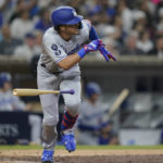 
              Los Angeles Dodgers' Miguel Vargas watches his two-run single during the sixth inning of the team's baseball game against the San Diego Padres, Thursday, Sept. 29, 2022, in San Diego. (AP Photo/Gregory Bull)
            