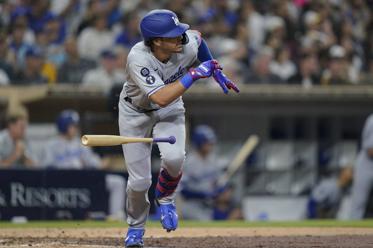 Los Angeles Dodgers' Miguel Vargas watches his two-run single during the sixth inning of the team's...