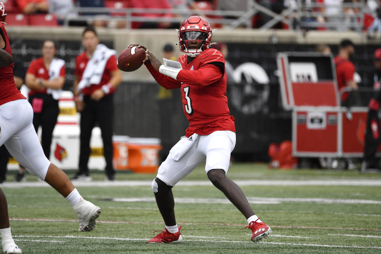 Louisville quarterback Malik Cunningham (3) drops back for a pass during the first half of an NCAA ...