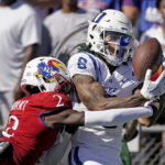 
              Duke wide receiver Eli Pancol (6) catches a pass under pressure from Kansas cornerback Cobee Bryant (2) during the first half of an NCAA college football game Saturday, Sept. 24, 2022, in Lawrence, Kan. (AP Photo/Charlie Riedel)
            