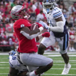 
              New Mexico running back Sherod White is brought down short of the goal line by Maine defender Xavier Mitchell during an NCAA college football game Saturday, Sept. 3, 2022, in Albuquerque, N.M. (Roberto E. Rosales/The Albuquerque Journal via AP)
            