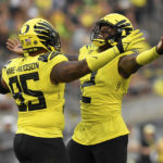 
              Oregon defensive tackle Keyon Ware-Hudson (95) and linebacker DJ Johnson (2) celebrate a sack against Eastern Washington during the second quarter of an NCAA college football game Saturday, Sept. 10, 2022, in Eugene, Ore. (AP Photo/Andy Nelson)
            