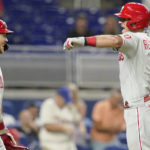 
              Philadelphia Phillies' J.T. Realmuto (10) celebrates with Alec Bohm after scoring on a solo home run during the sixth inning of a baseball game against the Miami Marlins, Wednesday, Sept. 14, 2022, in Miami. (AP Photo/Lynne Sladky)
            