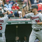 
              Minnesota Twins' Matt Wallner, right is congratulated by Mark Contreras after hitting a solo home run off Cleveland Guardians starting pitcher Shane Bieber during the eighth inning in the first game of a baseball doubleheader in Cleveland, Saturday, Sept. 17, 2022. Wallner made his Major League debut in the game. (AP Photo/Phil Long)
            