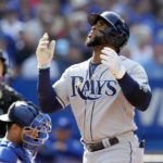 
              Tampa Bay Rays' Yandy Diaz reacts after hitting a three run home-run during the second inning of a baseball game against the Toronto Blue Jays in Toronto, Thursday, Sept. 15, 2022. (Frank Gunn/The Canadian Press via AP)
            