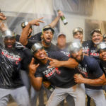 
              Cleveland Guardians players celebrate winning the American League Central in the locker room after defeating the Texas Rangers in a baseball game in Arlington, Texas, Sunday, Sept. 25, 2022. (AP Photo/Gareth Patterson)
            