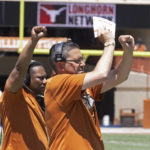 
              FILE - Texas assistant head coach Jeff Banks signals during the first half of the Texas Orange and White Spring Scrimmage in Austin, Texas, Saturday, April 24, 2021. Banks followed Texas head coach Steve Sarkisian from Alabama. (AP Photo/Michael Thomas, File)
            