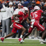 
              Houston wide receiver Nathaniel Dell (1) runs for a first down after a reception against UTSA during the second half of an NCAA college football game, Saturday, Sept. 3, 2022, in San Antonio. (AP Photo/Eric Gay)
            