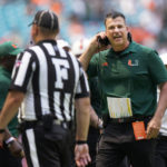 
              Miami head coach Mario Cristobal, right, argues a call with Field Judge Jake Dishaw during the second half of an NCAA college football game against Southern Miss, Saturday, Sept. 10, 2022, in Miami Gardens, Fla. (AP Photo/Wilfredo Lee)
            